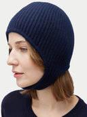 Woman wearing a navy blue knit beanie against a light gray background. #color_sodalite-blue