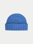 Blue knit beanie on a light gray background. #color_blue