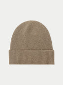 Beige knit beanie on a light beige background. #color_taupe