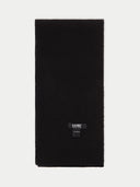 A black ribbed cashmere scarf with a label showing the brand name 'GOBBI' on the lower right side. #color_black