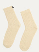 Pair of beige socks on a white background #color_beige