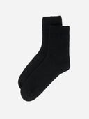 Black socks on a white background. #color_black