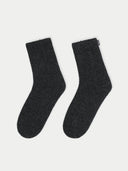 Pair of dark gray socks on a white background #color_charcoal