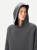 Person wearing a gray hoodie against a white background. #color_dark-gray