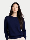 Woman wearing a navy blue sweater on a white background. #color_dark-indigo #ai-image