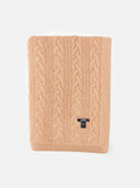 Beige cable knit blanket with a brand label on a white background. #color_light-brown