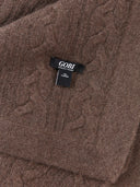 Brown cable knit sweater with a Gobi label. #color_brown