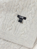 Close-up of a cable-knit sweater with a Gobi label. #color_steel-silver