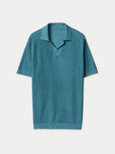 Teal polo shirt on a light gray background #color_mineral-green