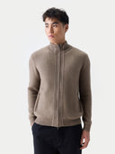 Man wearing a brown zip-up sweater against a white background. #color_taupe