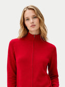 Woman wearing a red jacket against a white background. #color_warm-red #ai-image