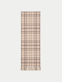 Flat lay of the taupe cashmere checked jacquard scarf with fringed ends.