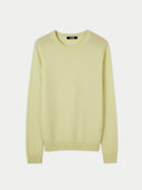 A crew neck cashmere jumper in a light yellow colour, presented in a flat lay format. #color_cream-yellow