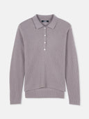 A gray women's cashmere polo shirt with a collar and button-up front. #color_stucco