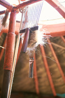 Traditional combs holding hand-combed Mongolian cashmere fibres, hanging inside a herder's ger frame