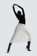 Model in black top and white ribbed knit midi skirt with boots, Black Friday cashmere deals