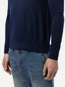 Navy sweater and blue jeans on a white background. #color_dark-indigo
