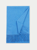 A blue cashmere fringed scarf laid out flat.