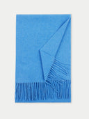 A blue cashmere fringed scarf laid out flat. #color_blue