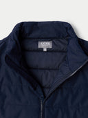 Navy blue jacket with Gobi brand label on a light gray background