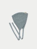 A blue cashmere bonnet for women with long earflaps, displayed against a plain background. #color_vapor-blue