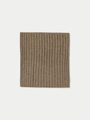 A beige cashmere neck collar scarf displayed on a flat surface. #color_taupe