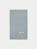 A gray rib knit scarf with a tag visible on the bottom right corner. #color_vapor-blue
