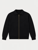 A black knit zip-up sweater with a polo-style collar and a prominent gold-tone front zipper, displayed on a clean, light gray background.