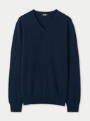 Navy blue sweater on a light gray background. #color_navy-blue