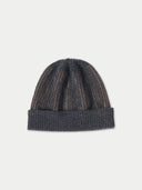 Knitted beanie with gradient color on a light gray background