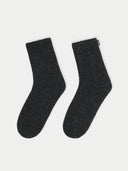 Pair of dark gray socks on a white background