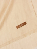 Beige scarf with a brown label featuring the brand 'GOBI'. #color_beige