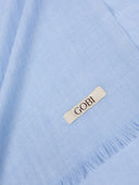 Close-up of a light blue fabric with a 'Gobi' label. #color_muted-blue