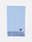 Light blue scarf with fringes on a white background