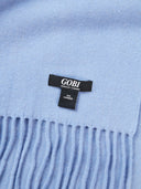 Close-up of a light blue scarf with a Gobi label.