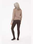 Person wearing a beige sweater and brown tights on a white background GOBI UK #color_mole