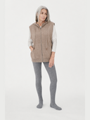 Woman wearing a beige sleeveless hoodie with a zipper on a white background GOBI UK #color_plum-kitten