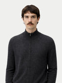 Man wearing a dark gray zip-up sweater against a white background. #color_charcoal #ai-image