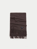 Brown scarf with fringes on a light gray background