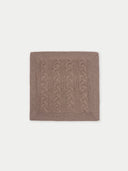 A brown knitted pillow cover with cable stitch detailing. #color_taupe