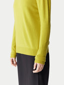 Yellow sweater worn by a person on a white background. #color_celery-green #ai-image