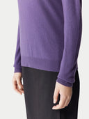 Purple sweater worn by a person on a white background. #color_dusty-grape