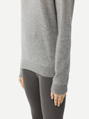 Gray sweater worn by a person on a white background. #color_urban-silver