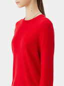 Red sweater worn by a person on a white background. #color_true-red