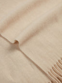 Close-up of a beige scarf with a fringe detail #color_beige