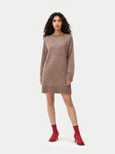 Woman wearing a brown sweater dress with red socks on a white background. #color_taupe #ai-image