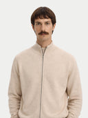 Man wearing a beige zip-up sweater against a white background. #color_beige #ai-image