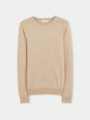 A beige crew neck cashmere sweater.