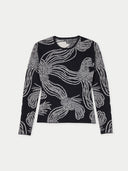 Black sweater with white floral pattern on a white background