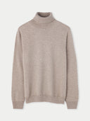 A beige cashmere turtle neck sweater.